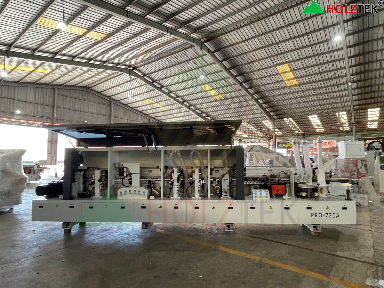 Máy dán cạnh tự động pro-720a Holztek cho sản xuất nội thất gỗ công nghiệp.